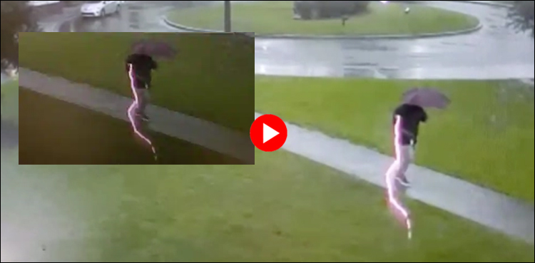 Scary moment a man is nearly hit by lightning